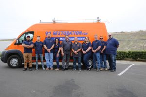 911-restoration-water-damage-mold-remediation-fire-damage-person-van-group-pic-background